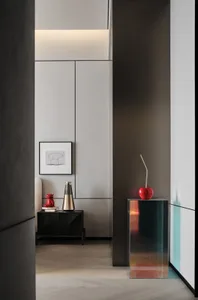 Modern luxury bedroom with concrete accents and sleek design elements.