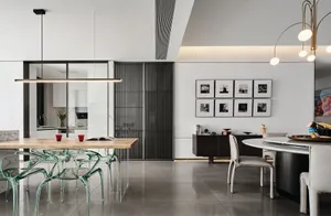 Modern dining room featuring sleek, transparent chairs, a wooden table, and contemporary artwork.