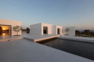 Modern, minimalist exterior featuring clean lines and concrete materials.