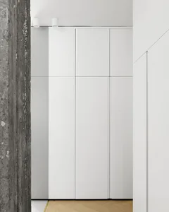 A modern white panel cabinet with clean lines and a minimalist design.
