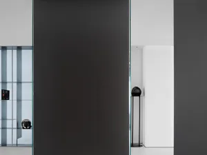 Interior design featuring a minimalist office space with black metal accents.