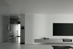 Minimalist modern reader sitting area with concrete floor and glass elements.