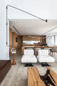 Modern living room featuring white furniture and wooden accents