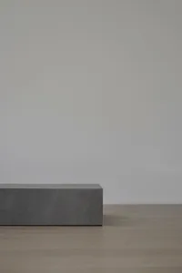 A minimalist furniture piece crafted from concrete.
