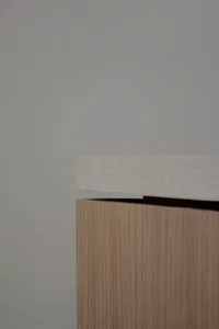 A minimalist interior design with wooden elements.