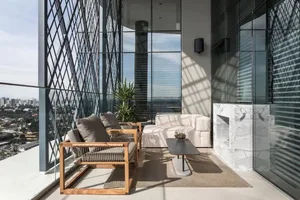 Contemporary balcony featuring wooden seating and glass wall.