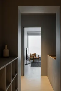 Modern interior design featuring a minimalist concrete floor and walls.