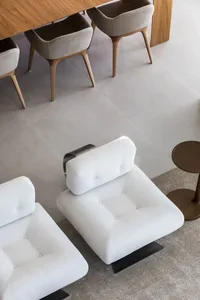 Modern living room with white couch and minimalist design.