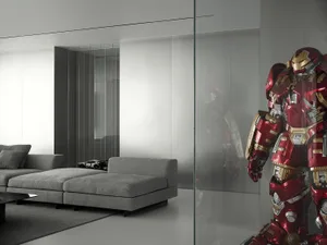 Modern living room with a contemporary upholstered sofa and a red armored figure.