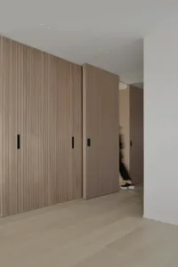 Interior of a modern minimalist house featuring wood and concrete elements