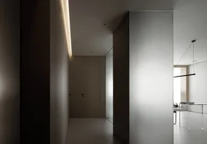 An elegant modern office with glass walls and concrete flooring.