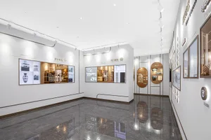 A spacious showroom featuring modern digital displays showcasing various products.