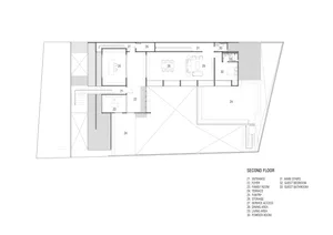 Black and white diagram of a residential house's second floor layout, featuring key rooms and spaces.