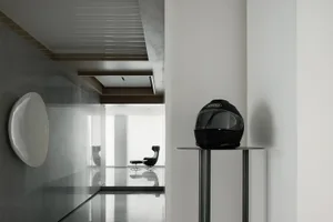 Modern minimalist interior with concrete walls and floor.
