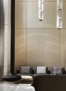 Modern, industrial-style lobby featuring metallic furniture and minimalist design.
