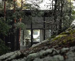 Modern residential house with glass wall exterior.
