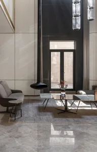 Modern minimalist living room featuring marble and glass elements.