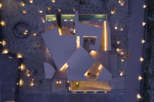 A minimalist residential building with concrete walls and a modern design.