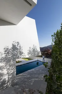 A modern architectural space featuring a concrete structure and minimalistic design.