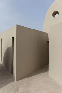 Modern residential architecture featuring a minimalist design in sandstone exterior material.
