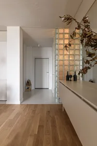 A modern residential interior displaying wooden flooring and contemporary design elements.