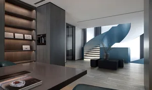 A modern living room featuring sleek, minimalist design with metallic accents and natural light.