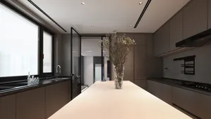 Modern residential kitchen featuring glass and marble materials with metal accents.