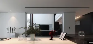 Modern living room featuring glass and marble materials.