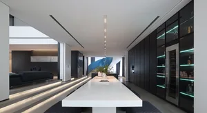 A sleek, modern dining room with minimalist design, concrete floors, glass walls, and black accent walls.
