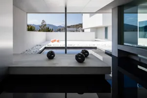 Modern, minimalist design featuring concrete elements in an outdoor setting.