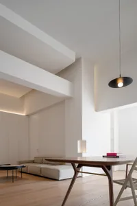 Modern minimalist living room with a sleek, clean aesthetic.