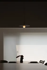 A modern interior space featuring minimalist design and contemporary lighting fixtures.