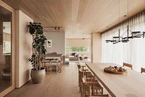 Modern residential interior design with wood materials and a minimalistic approach.