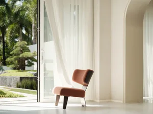 A modern living room featuring a textured fabric chair.