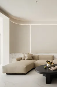 Modern living room with neutral-toned leather furniture and a minimalist design