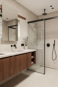 Modern bathroom featuring glass shower enclosure, wooden vanity, and minimalist decor.