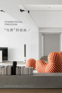 A modern living room featuring metallic accent furniture and a minimalist design.