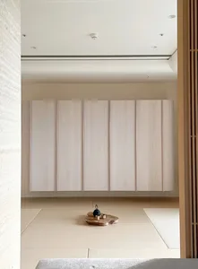 Modern minimalist living room featuring wooden textures and clean lines.