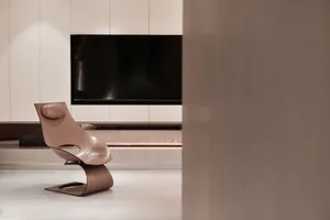 Modern minimalist living room featuring a wooden chair