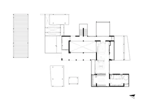 Plan of a modern residential building featuring a roof terrace and outdoor deck.