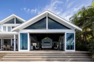 Modern house exterior painted entirely in white paint.