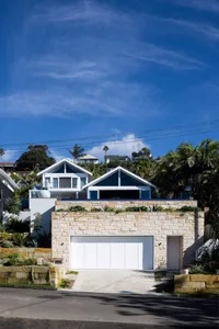 Modern house with stone brick facade and garage.