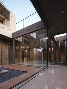 Modern interior design featuring brick and glass materials.