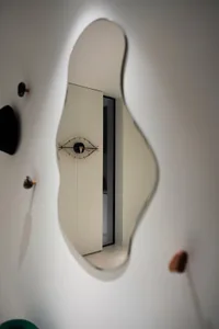 A modern glass mirror wall in an interior space