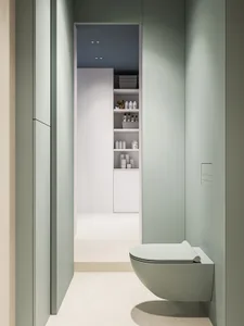 A modern minimalist bathroom with a sleek white toilet and white porcelain tiles.
