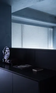 A minimalistic, industrial-style black interior moodboard featuring a record player, a record, and a book on a window sill wi