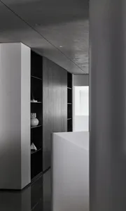 Contemporary minimalist interior featuring sleek, modern design and concrete finishes.