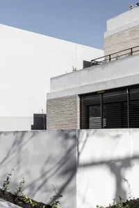 The image showcases a modern building made of concrete.