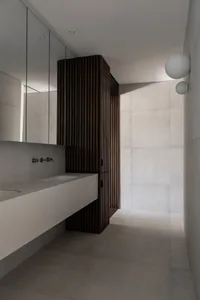 Minimalist bathroom with concrete and wood materials