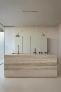 Modern kitchen with a terrazzo countertop and minimalist design elements